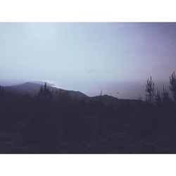 Silhouette landscape against clear sky