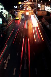 Traffic light trails on city street at night