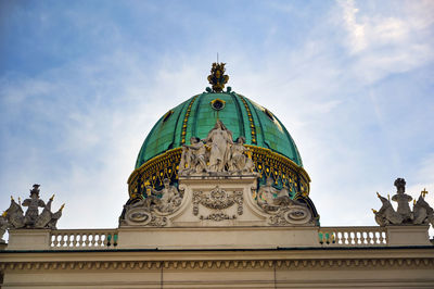 Low angle view of statue of building against sky