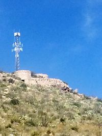 Low angle view of tower against clear blue sky