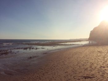 View of beach against sky during sunset