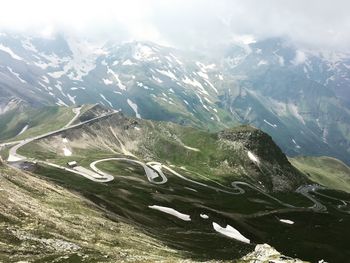 Aerial view of snowcapped mountains against sky