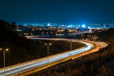 High angle view of light trails on road at night