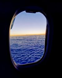 View of sea seen through airplane window