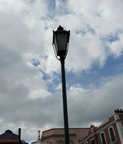 Low angle view of street light against sky