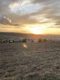 Scenic view of sunset over land