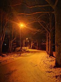 View of illuminated street at night