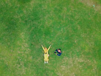 Aerial view of couple on grassy land in park