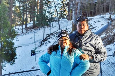 Portrait of woman in snow covered forest