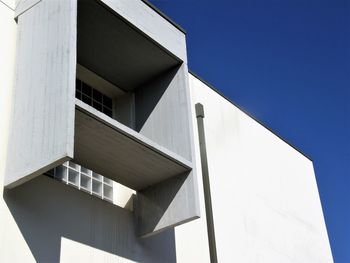 Low angle view of modern building against clear sky