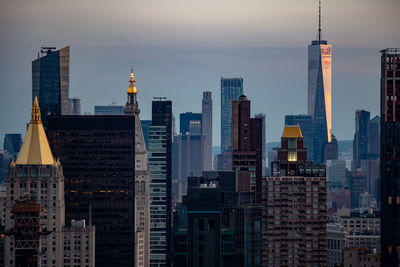 Modern buildings in city against sky