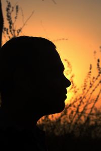 Close-up of silhouette man against sky during sunset