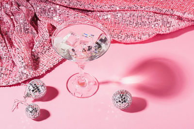 Close-up of pink glass on table