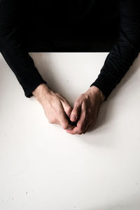 Close-up of woman hand on table