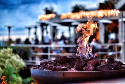 Close-up of food on barbecue grill against sky