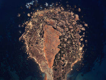 Aerial view of rocks on shore 