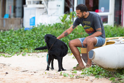 Full length of man with dog