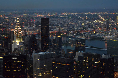 Aerial view of illuminated cityscape at night