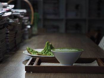 Close-up of coffee and breakfast on table