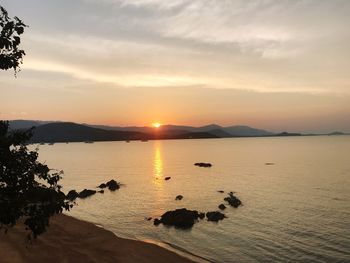 Scenic view of lake against sky during sunset