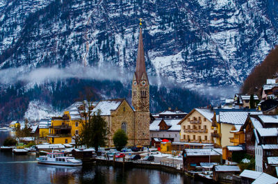 Town by lake against mountain