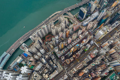 Aerial view of buildings by river in city