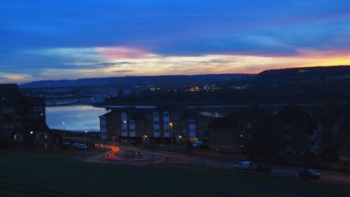 View of illuminated city at dusk