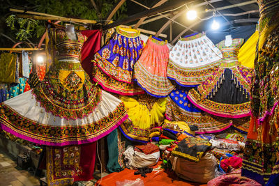 Low angle view of illuminated lanterns hanging outside building