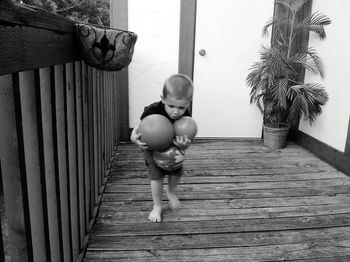 Boy standing on wood