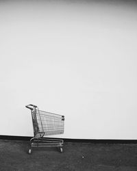 Shopping cart by wall