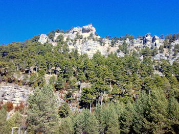 Scenic view of mountains against clear blue sky