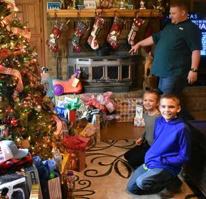 Rear view of mother and girl on christmas tree