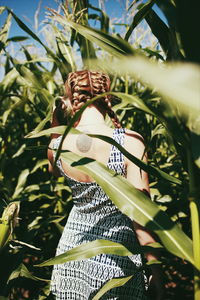 Woman standing on plant