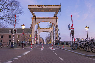 Medieval drawbridge in amsterdam netherlands at sunset