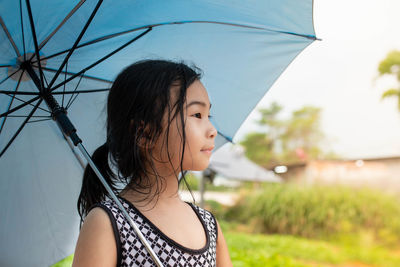 Portrait of young woman standing outdoors