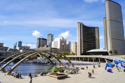 Panoramic view of modern buildings in city against sky