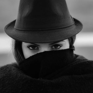 Portrait of a woman covering her face with veil