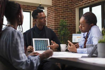 Young man using laptop at office