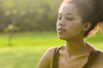 Portrait of young woman looking away