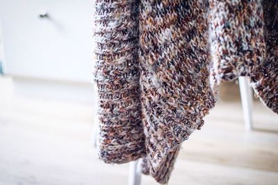 Close-up of sweater on chair