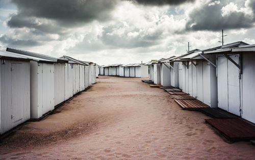 Corridor on beach against sky