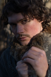 Portrait of young man looking away