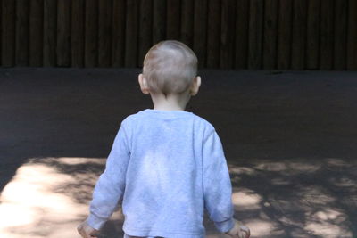 Boy standing outdoors