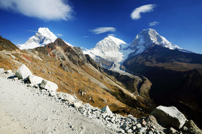 View of mountain peaks with snow against sky