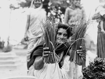 Portrait of woman standing outdoors