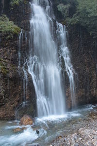 Scenic view of waterfall in forest