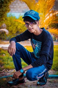 Portrait of young man sitting outdoors