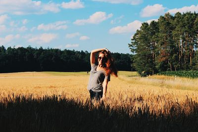 Cropped image of woman writing on rock with chalk