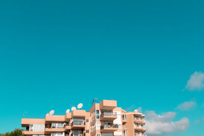 Low angle view of building against blue sky