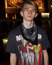 Portrait of young man standing in darkroom